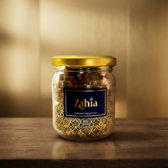 Firefly_Gemini-Flash_Place-the-uploaded-perfume-bottle-on-the-wooden-table-in-the-uploaded-background._Rem-425368-1-333x333 البخور اليمني الفاخر من زاهية للأعراس والمناسبات والضيافة الراقية